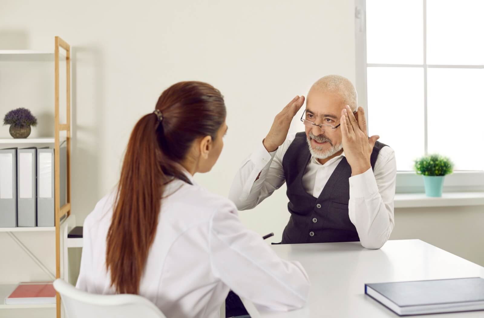 A senior discusses vaping and how it might affect their brain health with their healthcare provider.